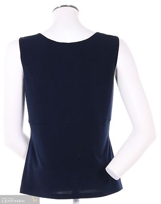 Tian ryhdikäs, joustavasta materiaalista valmistettu toppi v-pääntiellä