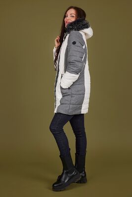 Normann valkoinen talvitakki harmailla yksityiskohdilla