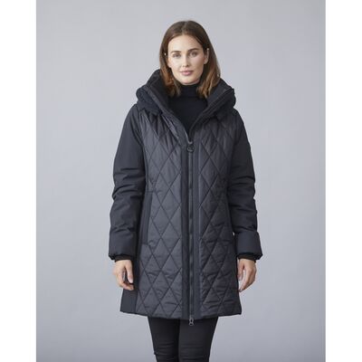 Junge musta tikattu toppatakki