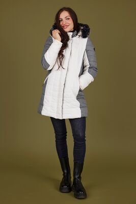 Normann valkoinen talvitakki harmailla yksityiskohdilla