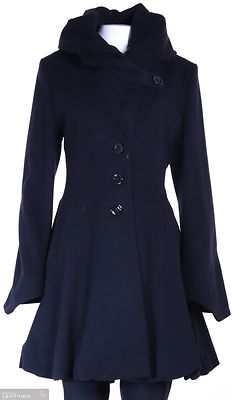 Erich fend näyttävä kellohelmainen musta villakangastakki